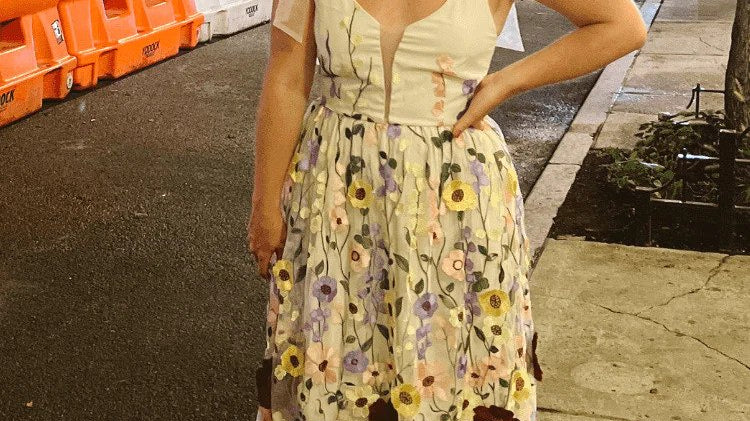 model wearing a fall wedding guest outfit