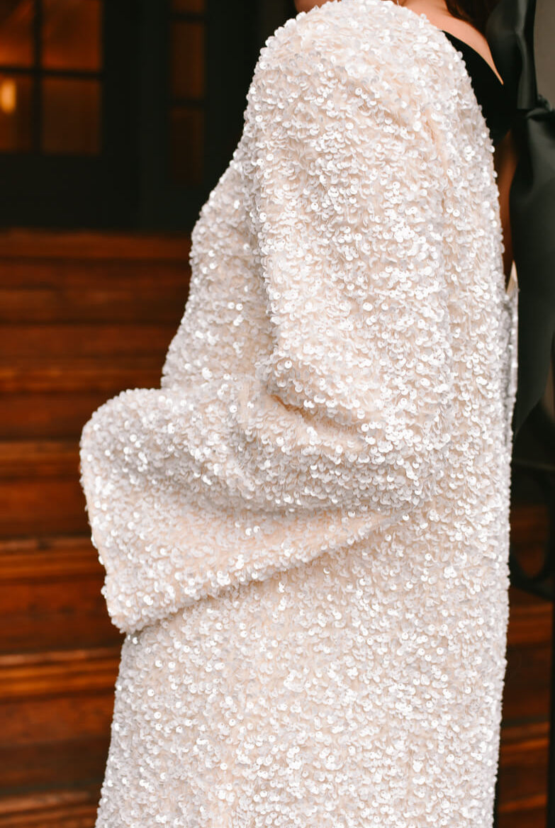 viral white sequin mini dress with black bow tie back, white sequin mini dress with black bow