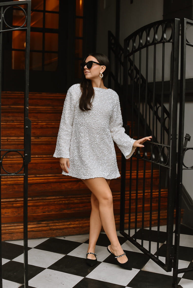viral white sequin mini dress with black bow tie back, white sequin mini dress with black bow