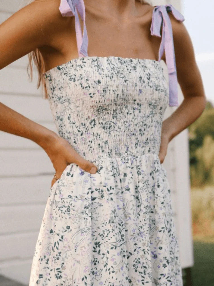model wearing a lilac floral dress