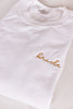 white sweatshirt with gold embroidered bride