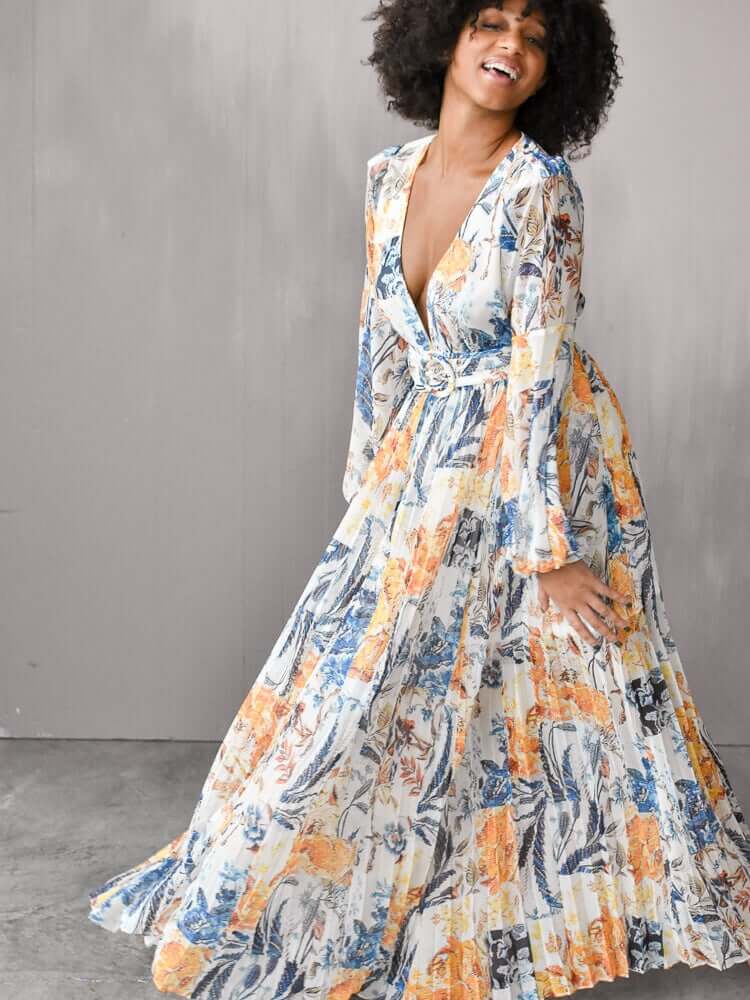 model wearing a belted floral maxi dress