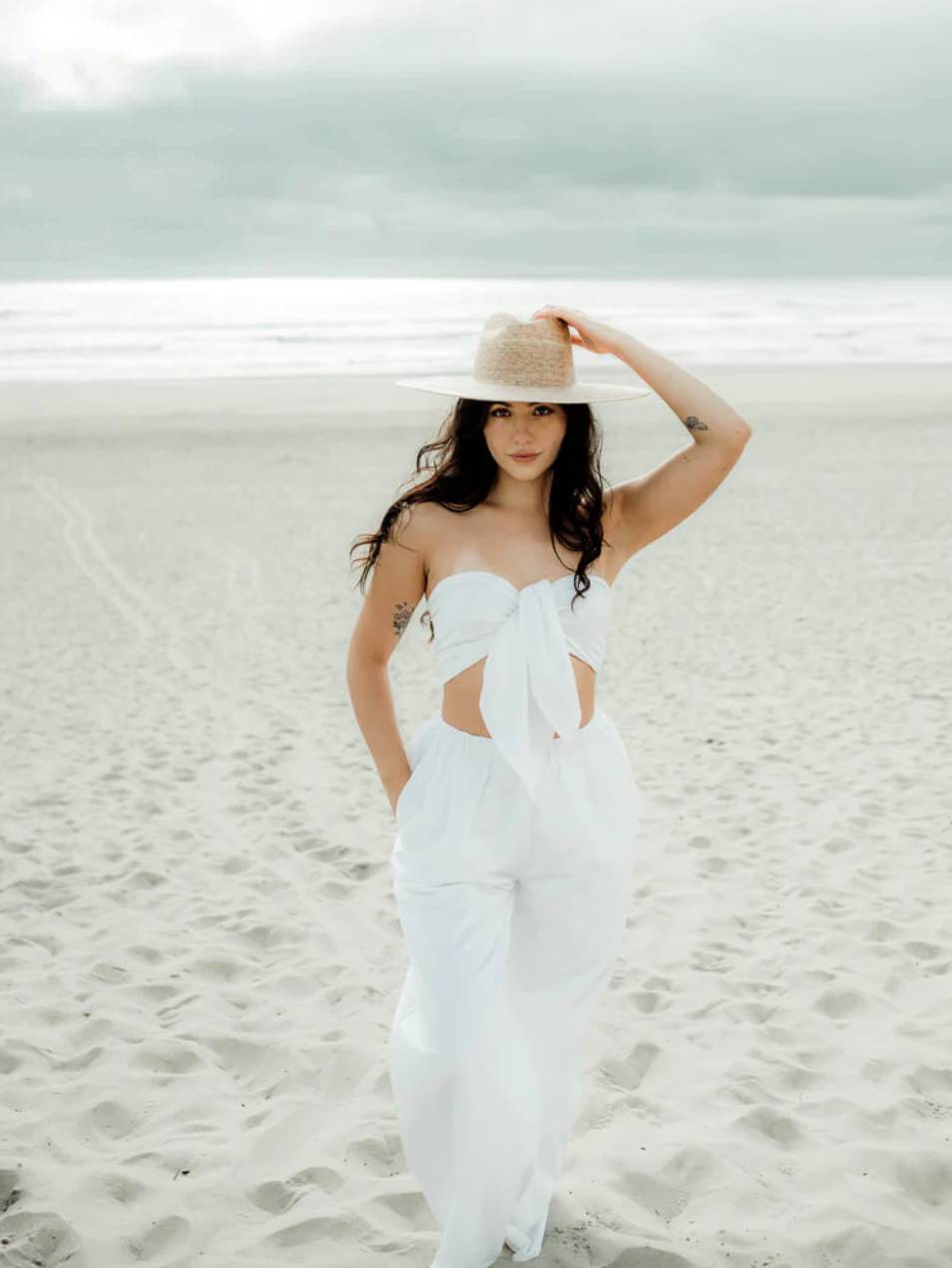 woman wearing two-piece white honeymoon outfit
