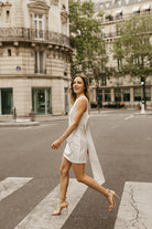 white satin sheath mini dress with bow back for engagement photo dress for bride shot in paris