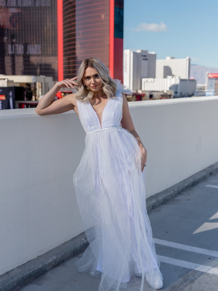 white tulle maxi dress with deep v and decorative shoulder detail