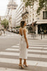 white sequin sheath dress with bow back detail for engagement photos in paris