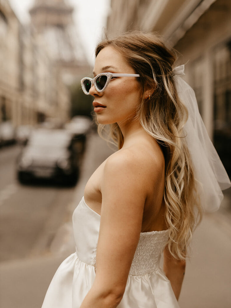 white tiered satin mini dress for paris engagement photos