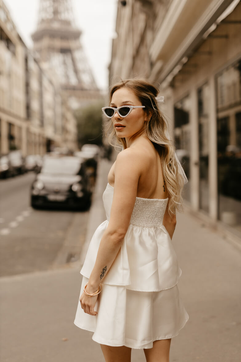 white tiered satin mini dress for paris engagement photos