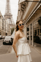 white tiered satin mini dress for paris engagement photos