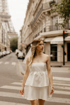 white tiered satin mini dress for paris engagement photos