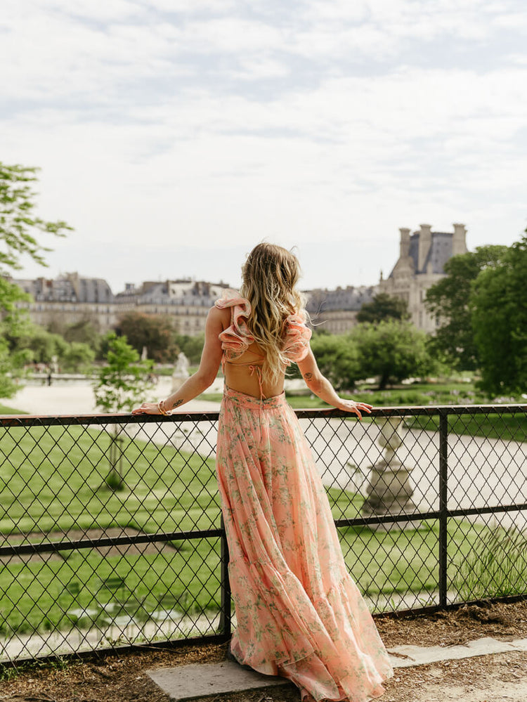 coral floral dress with bold ruffle shoulder for paris engagement photos