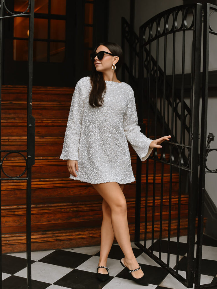 viral white sequin mini dress with black bow tie back, white sequin mini dress with black bow