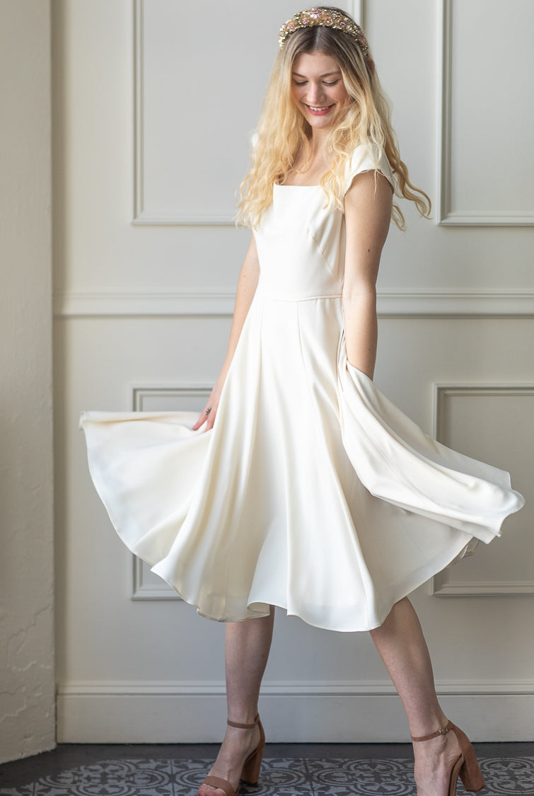 <p>&nbsp;<rehearsal dinner dress, white a line dress, a line white dress, a-line white dress, white a-line midi dress, gal meets glam, white dresses for bride