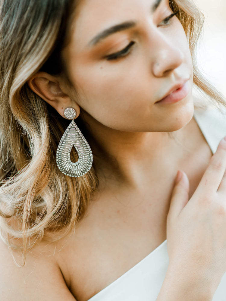 silver beaded teardrop shaped statement earrings