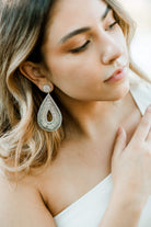 silver beaded teardrop shaped statement earrings