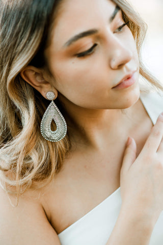 silver beaded teardrop shaped statement earrings