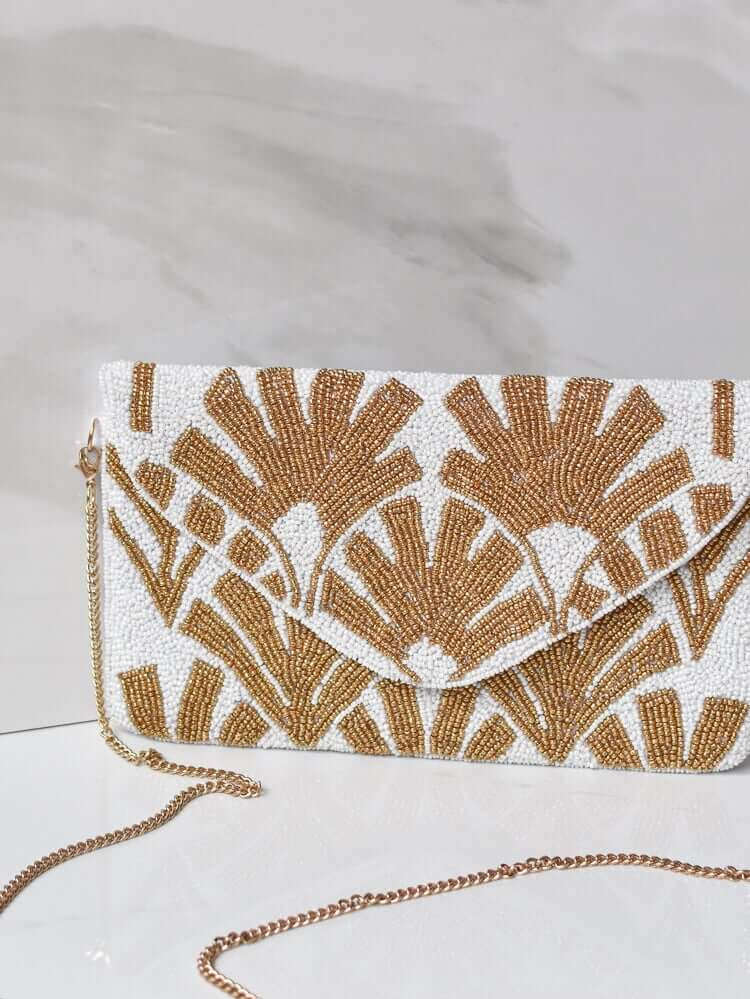 gold and white retro palm clutch, bachelorette party outfits, bachelorette accessories