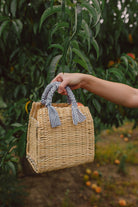 striped fabric wrapped handle straw bag, fabric handle straw bag, straw bag with fabric handle, woven bag, straw handbags, basket purses, cute summer bags, best summer bags, wooden purse, preppy style, southern preppy style, preppy fashion style, preppy style for women, boutiques, online boutique, botique, ecofriendly bag, dress websites