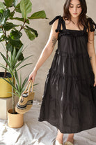 black cotton sundress with pom poms