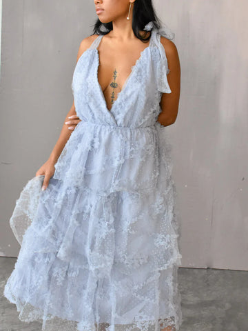 model wearing a blue tulle midi dress