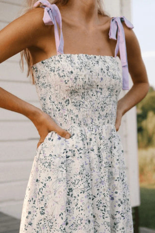 model wearing a lilac floral dress