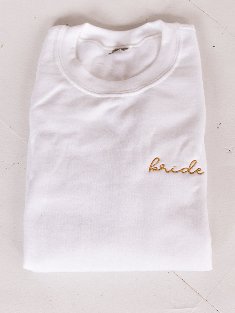 white sweatshirt with gold embroidered bride