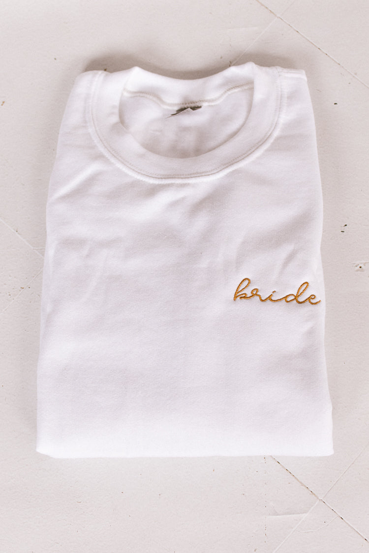 white sweatshirt with gold embroidered bride