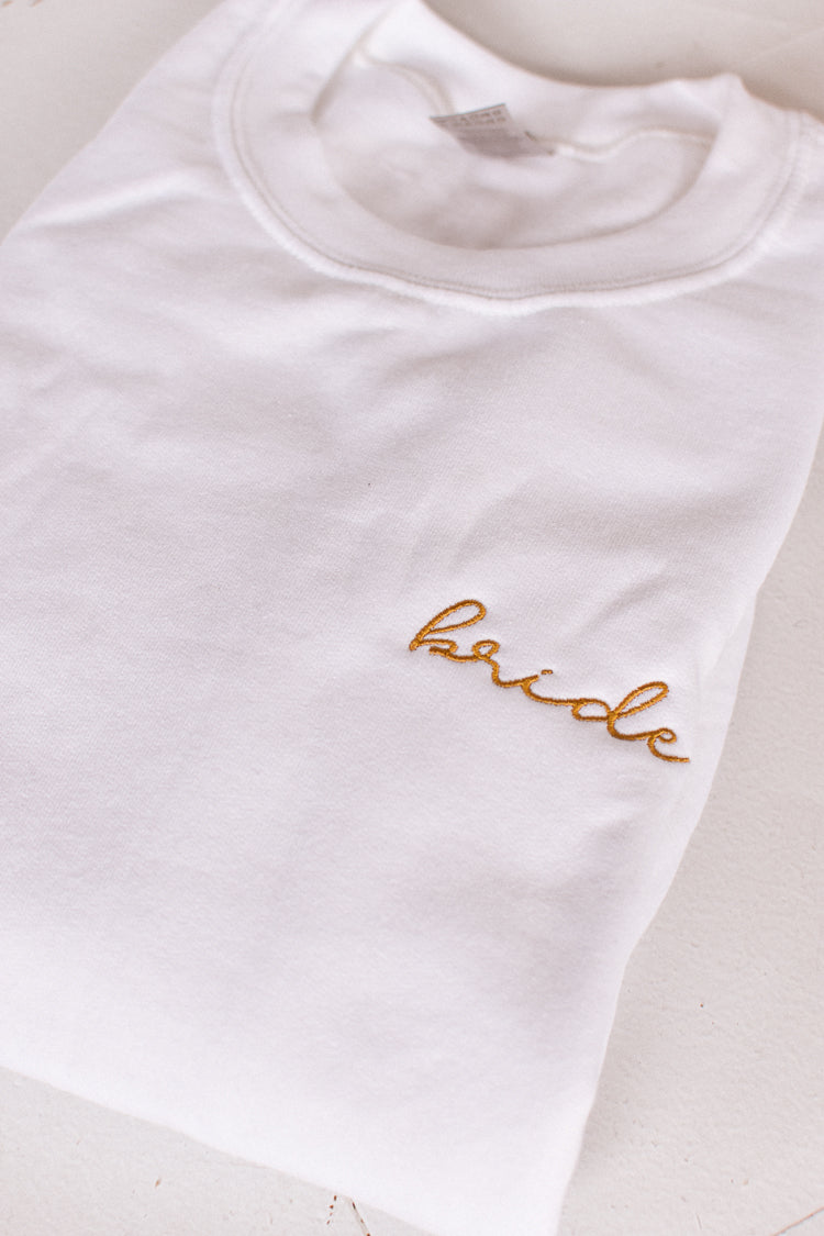 white sweatshirt with gold embroidered bride